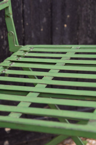 Close-up image of the chair seat from the Green Metal Garden Table & Chair Set