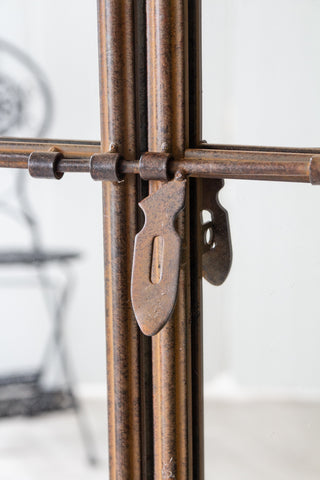 Close-up image of the closing clasp on the Large Antique Metal Window Mirror With Opening Doors