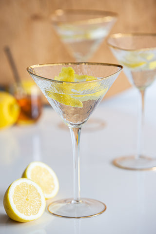 Lifestyle image of the Organic Cocktail Glass With Gold Rim with 2 more in the background
