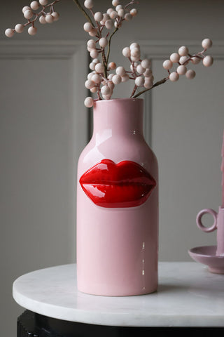 Lifestyle image of the Pink Ceramic Vase With Luscious Red Lips