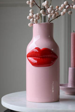 Close-up lifestyle image of the Pink Ceramic Vase With Luscious Red Lips
