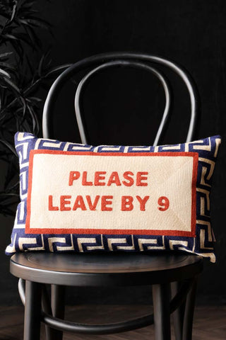 Lifestyle image of the Please Leave By 9 Cushion
