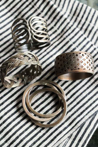 Image of the Set Of 4 Individual Design Brass Napkin Rings