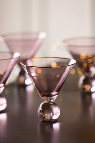 Lifestyle image of the Set Of 4 Gold Rim Rose Tinted Martini Glasses