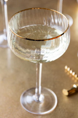Image of one of the glasses from the Set Of 4 Ribbed Champagne Coupe Glasses With Gold Rim
