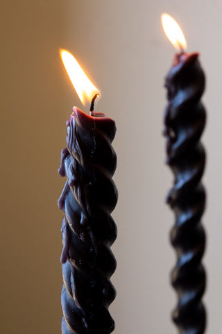 Close-up image of the Set Of 4 Spiral & Twisted Black Dinner Candles