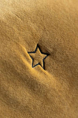 Close-up image of the Signature Gold Velvet Star Quilt