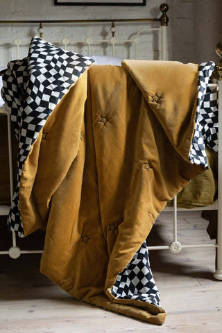 Lifestyle image of the Signature Gold Velvet Star Quilt