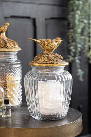 Lifestyle image of the Round Antique Bird Decorative Glass Jar