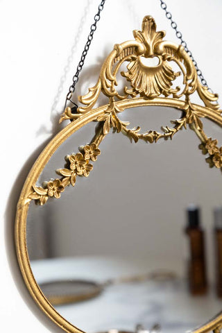 Close-up image of the Small Pretty Gold Hanging Mirror