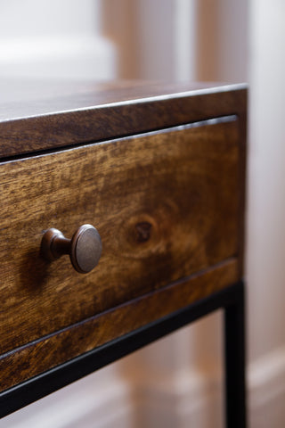 Close-up image of the drawer knob on the Split Level 2-Drawer Mango Wood Bedside Table