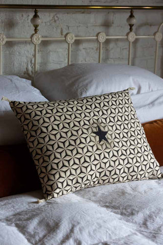 Lifestyle image of the Monochrome Star Cotton Cushion