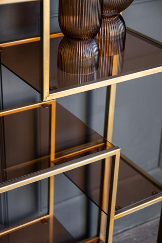Close-up image of the frame & glass on the Tall Gold & Glass Art Deco Shelving Unit