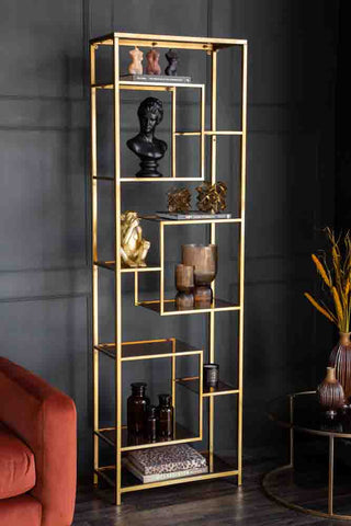 Angled lifestyle image of the Tall Gold & Glass Art Deco Shelving Unit
