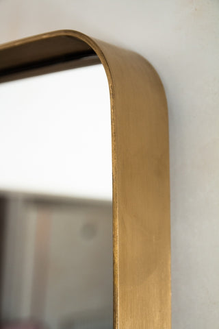 Image of the top corner of the Tall Slim Full-Length Mirror With Rounded Gold Surround