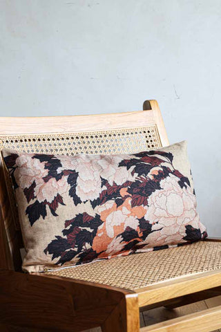 Lifestyle image of the Tokyo Floral Printed Cushion on a chair