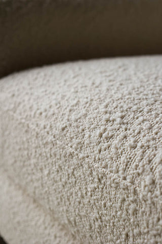 Close-up image of the Ivory Boucle Fabric Curved Arm Armchair