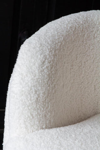 Close-up image of the arm on the White Teddy Armchair With Gold Legs