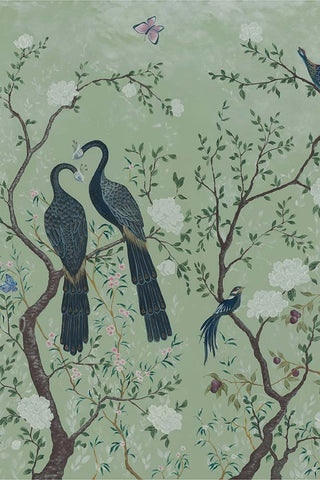 A close up image of a wallpaper depicting two large birds in a floral tree on a green background. 
