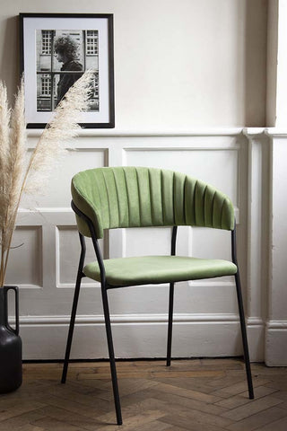 Lifestyle image image front on at an angle of the Curved Back Velvet Dining Chair In Moss Green