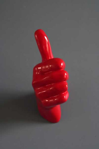 lifestyle image of front of thumbs up hand wall art & coat hook red on grey wall background
