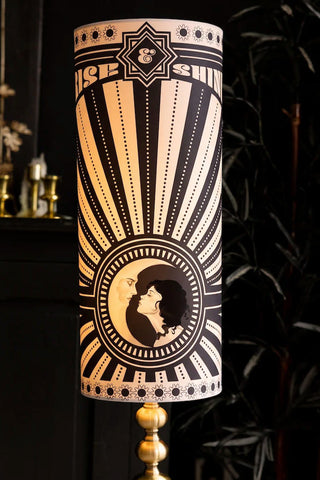 A beautiful monochrome floor lamp, featuring a half moon and moonbeams 