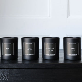 image of four scented candles sat on a mantlepiece