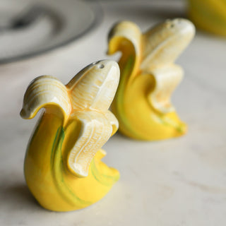 The Banana Salt & Pepper Shakers displayed together on a kitchen worktop.