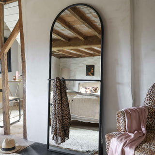 Lifestyle image of the Tall Black Floor Mirror With Hanging Rail.