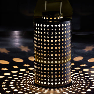 The Black Star Solar Light displayed in the dark casting pretty light patterns onto the floor.