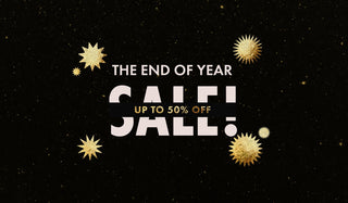 End of year sale advertisement with gold stars on a black background