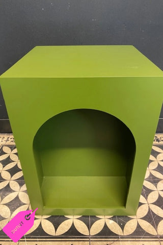 Image of The Green Alcove Wooden Side Table on a geometric floor against a dark wall