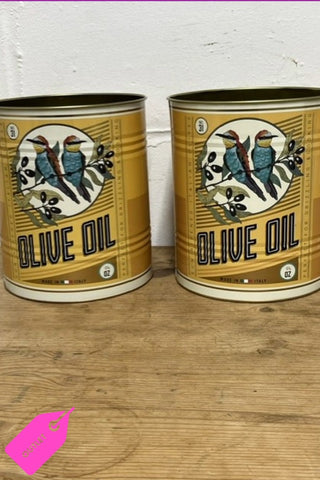 Image of the Set Of 2 Olive Oil Storage Tins on a wooden surface