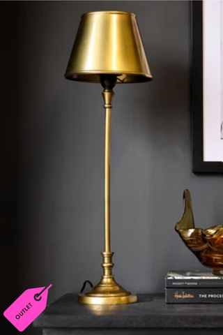 The Slim Antique Brass Table Lamp with Metal Shade lifestyle image with a dark background