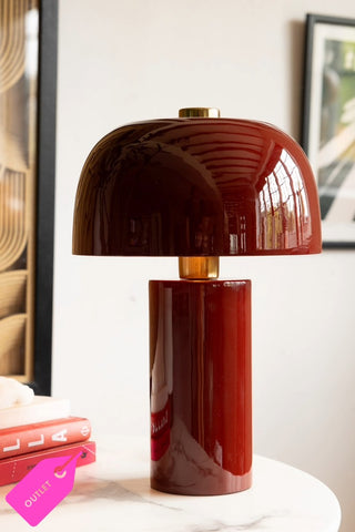 Close up of deep red, glossy table lamp