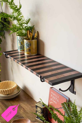 The Black Stripe Wooden Shelf With Bracket styled with various kitchen accessories and greenery.