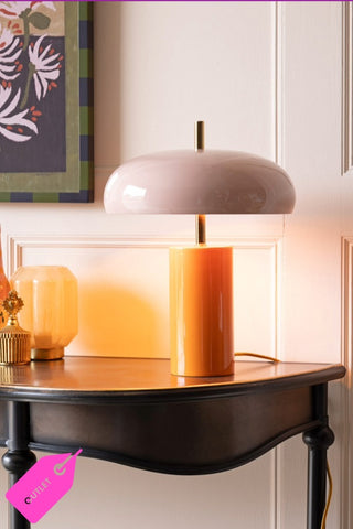 The Pink & Orange Statement Table Lamp styled on a hallway table