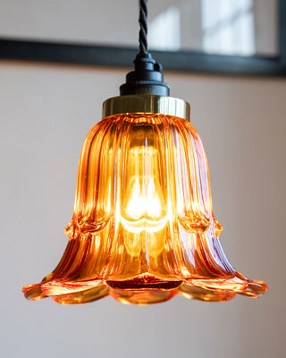 A beautiful amber glass ceiling light pendant suspended from the ceiling.