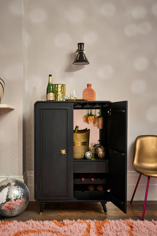 Lifestyle image of the Black & Gold Ringo Drinks Cabinet