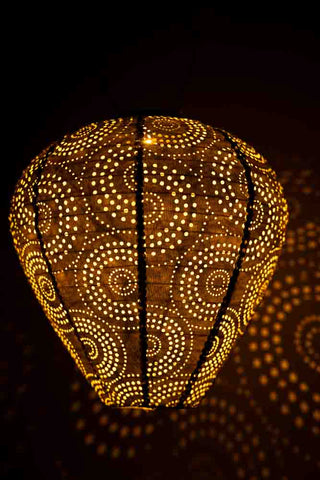 Lifestyle image of the Gold Bell Solar Garden Lantern