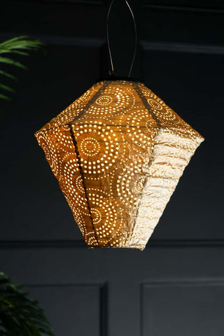 Lifestyle image of the Gold Diamond Solar Garden Lantern