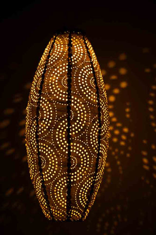 Lifestyle image of the Gold Oval Solar Garden Lantern