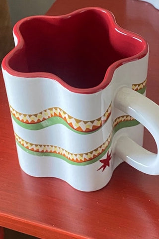 Close up of Star Shaped Mug with Snake Print Detail 