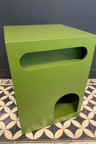 Image of The Green Alcove Wooden Side Table on a geometric floor against a dark wall