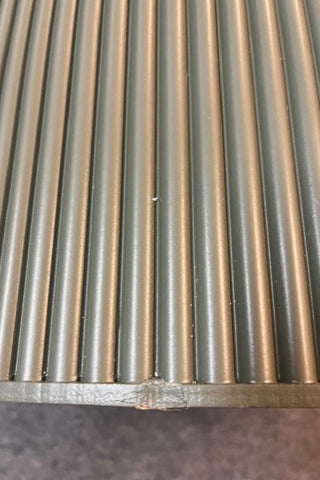 Detail of the bottom of the Olive Green Ribbed Coffee Table