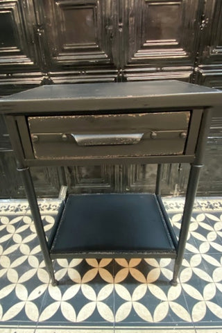 Front view of The Metal Industrial Bedside Table on a geometric floor