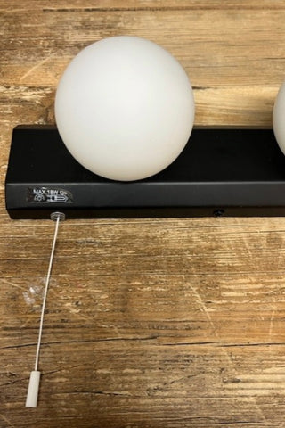 Close up of The Hollywood Vanity Wall Light in Black.