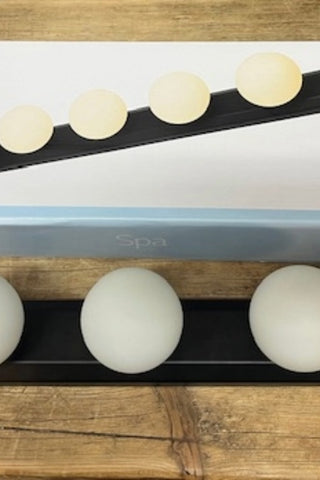 The Hollywood Vanity Wall Light shown with the box.