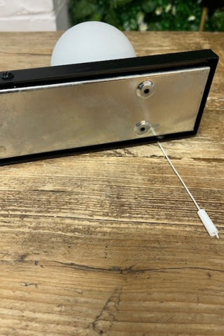 The back of The Hollywood Vanity Wall Light in Black.