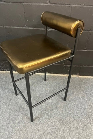Side view of the Burnished Gold Roll Back Bar Stool
